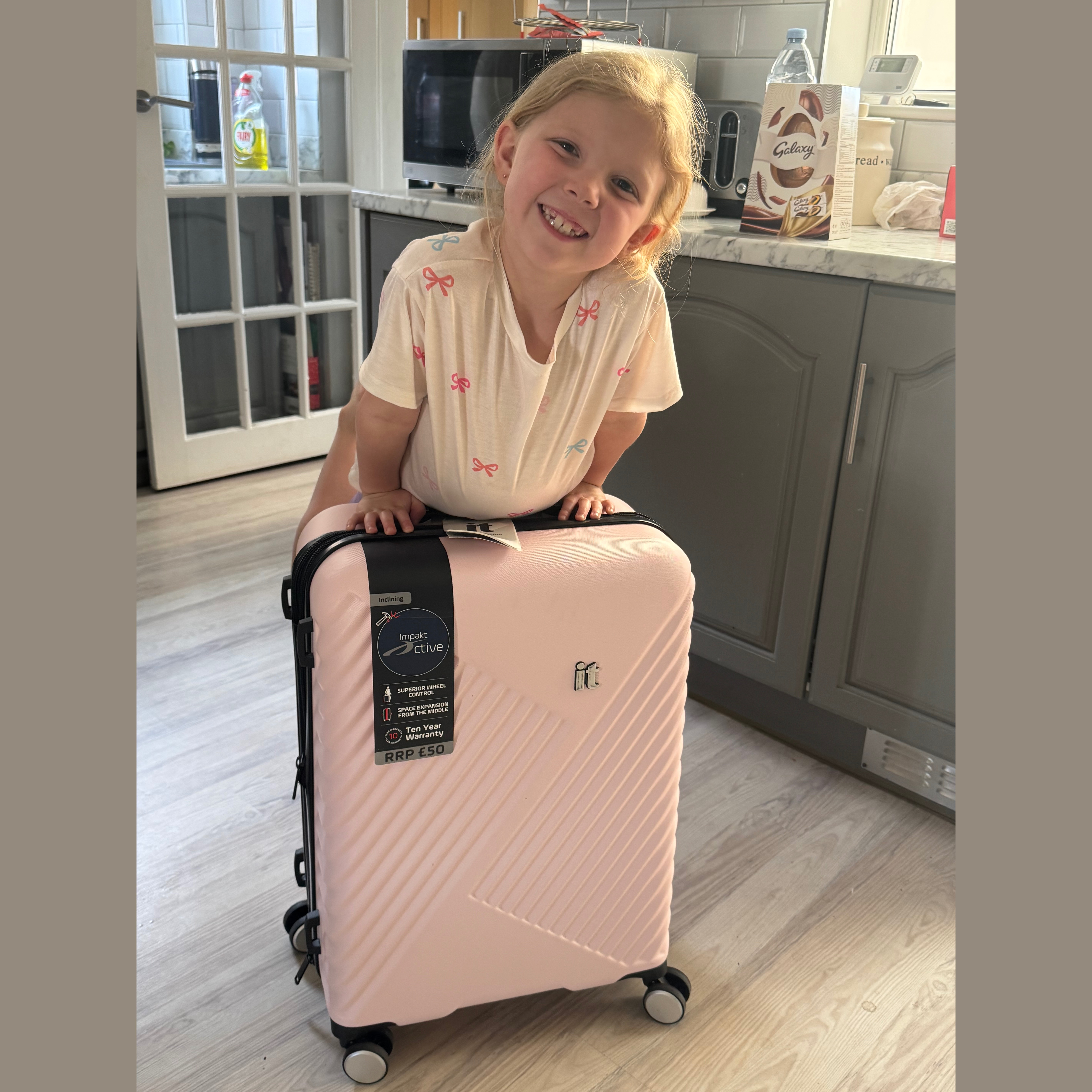 It medium pink suitcase 24"
